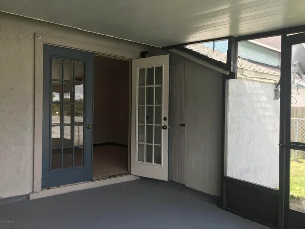 a view of an empty room with a large window
