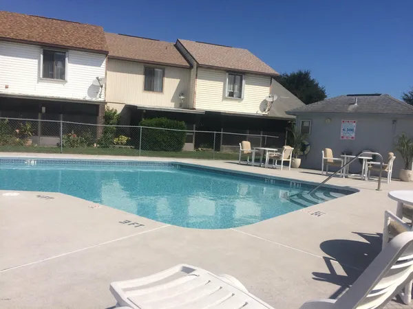 a view of a house with swimming pool