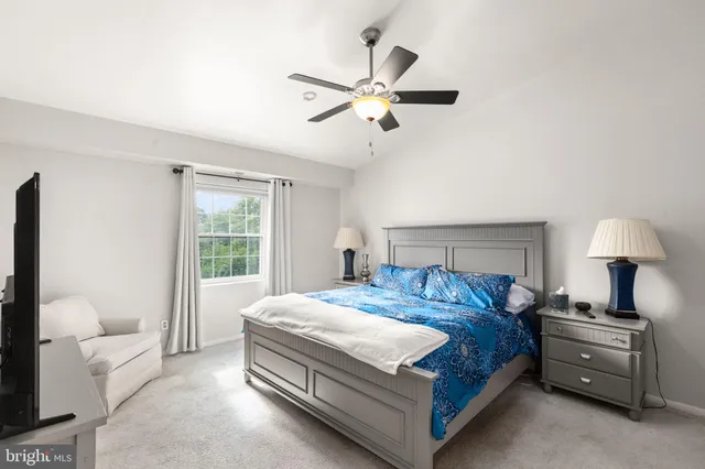 a living room with furniture and a dresser