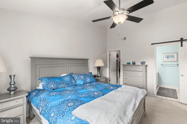 a view of walk in closet with clothes