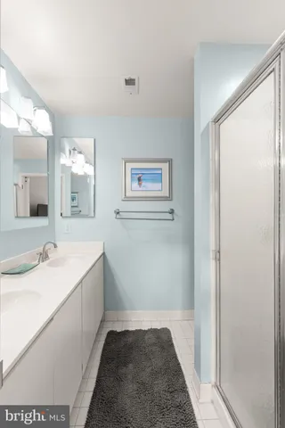 a bedroom with furniture and a flat screen tv