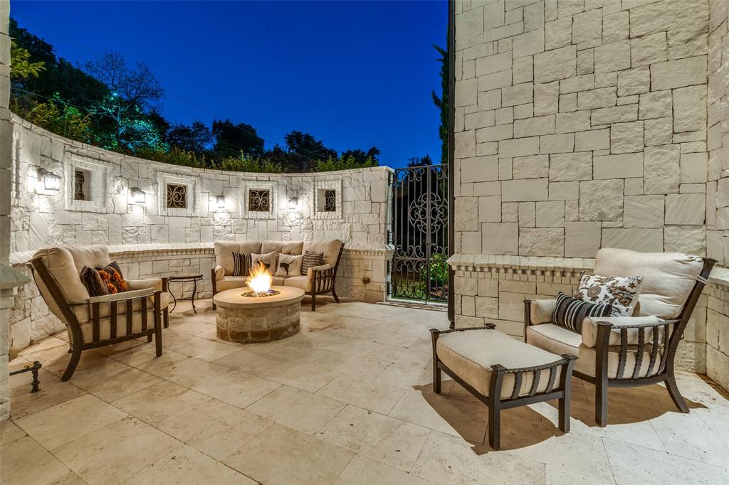 4511 Watauga Road Dallas, TX 75209 - Photo 13 of 40 a view of a patio with couches and a table and chairs