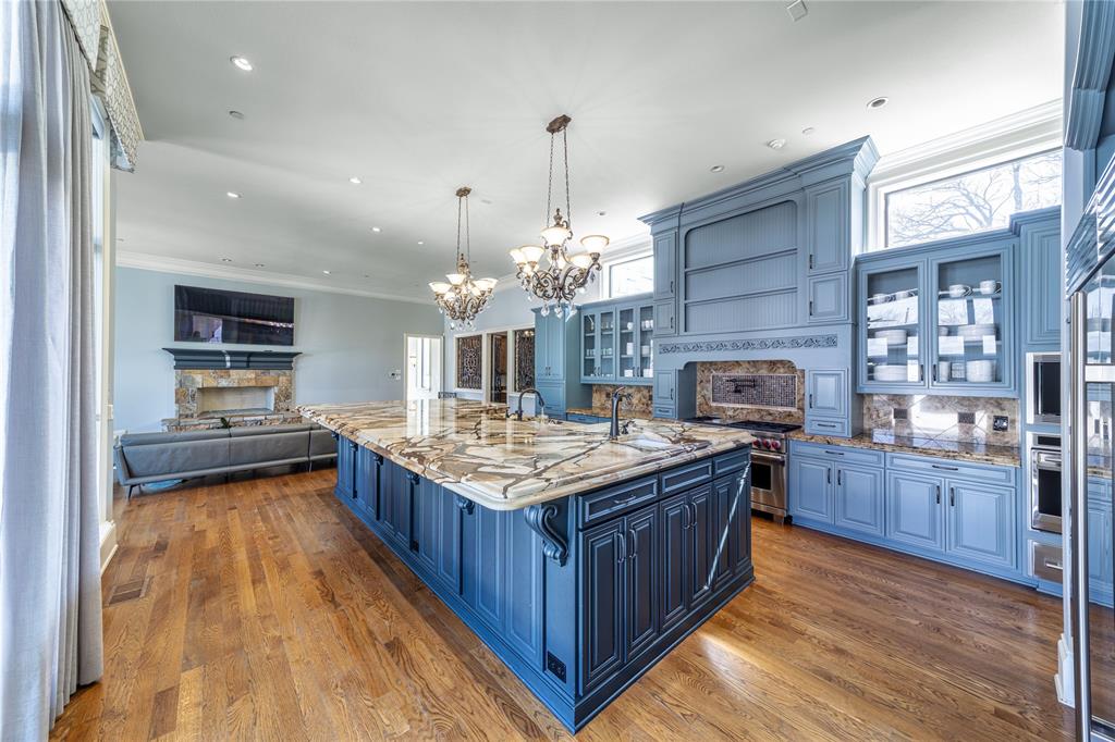 4511 Watauga Road Dallas, TX 75209 - Photo 14 of 40 a kitchen with granite countertop stove top oven and refrigerator