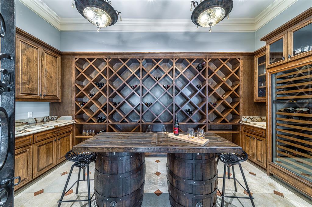 4511 Watauga Road Dallas, TX 75209 - Photo 18 of 40 a kitchen with a stove a sink and cabinets