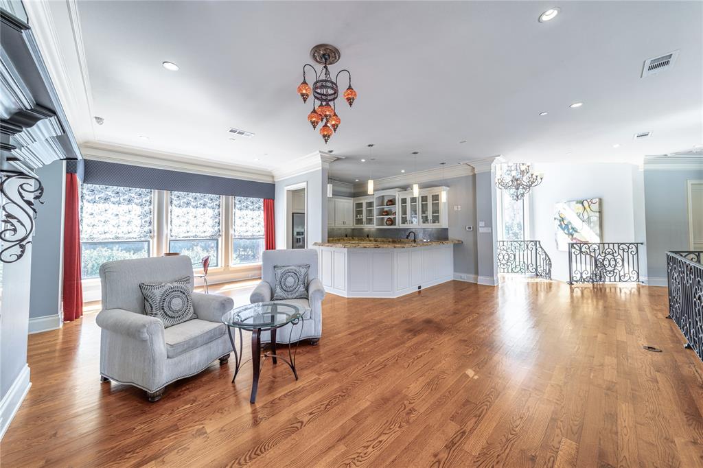 4511 Watauga Road Dallas, TX 75209 - Photo 23 of 40 a living room with fireplace furniture and a wooden floor
