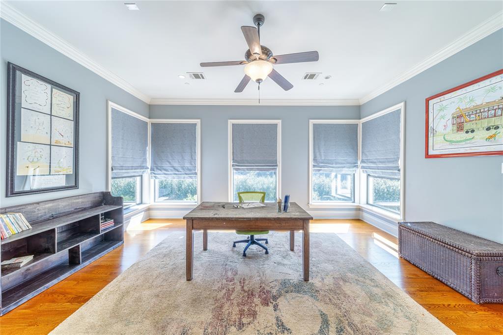 4511 Watauga Road Dallas, TX 75209 - Photo 25 of 40 a living room with furniture a window and a dining table