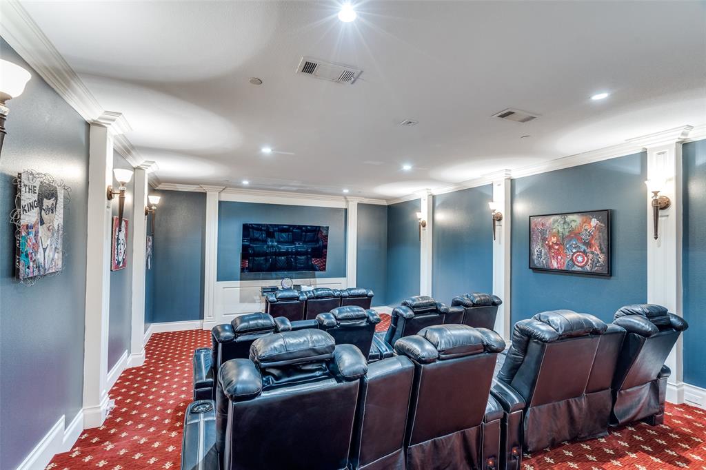 4511 Watauga Road Dallas, TX 75209 - Photo 26 of 40 a media room with lots of chairs and a projector screen