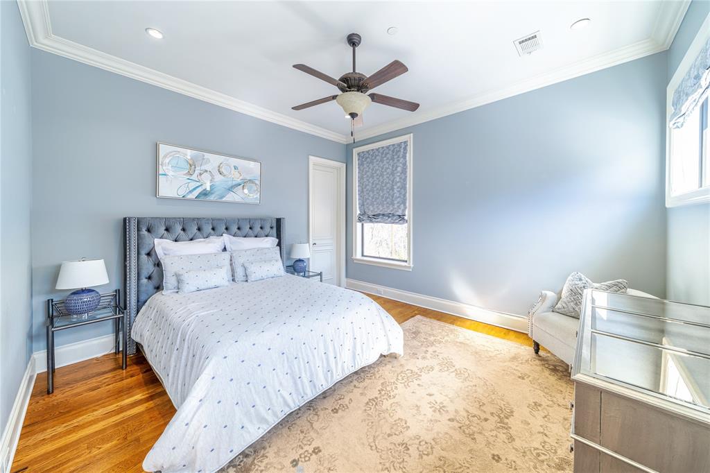 4511 Watauga Road Dallas, TX 75209 - Photo 27 of 40 a bedroom with a bed and window