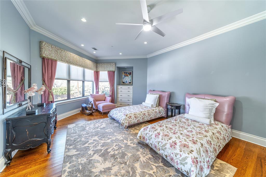 4511 Watauga Road Dallas, TX 75209 - Photo 28 of 40 a bedroom with two beds and a large window