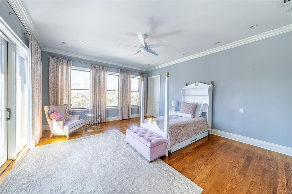 4511 Watauga Road Dallas, TX 75209 - Photo 29 of 40 a bedroom with a bed and wooden floor