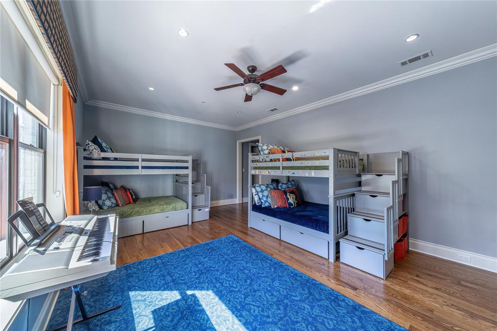 4511 Watauga Road Dallas, TX 75209 - Photo 30 of 40 a bedroom with furniture and a wooden floor