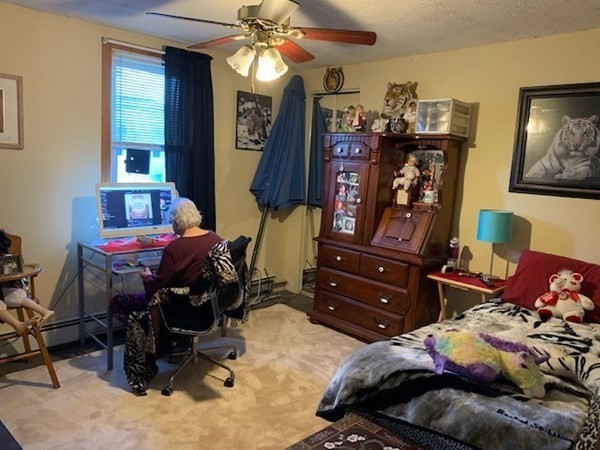 192 Last Street Fall River, MA 02724 - Photo 17 of 33 a bedroom with a bed and a chandelier