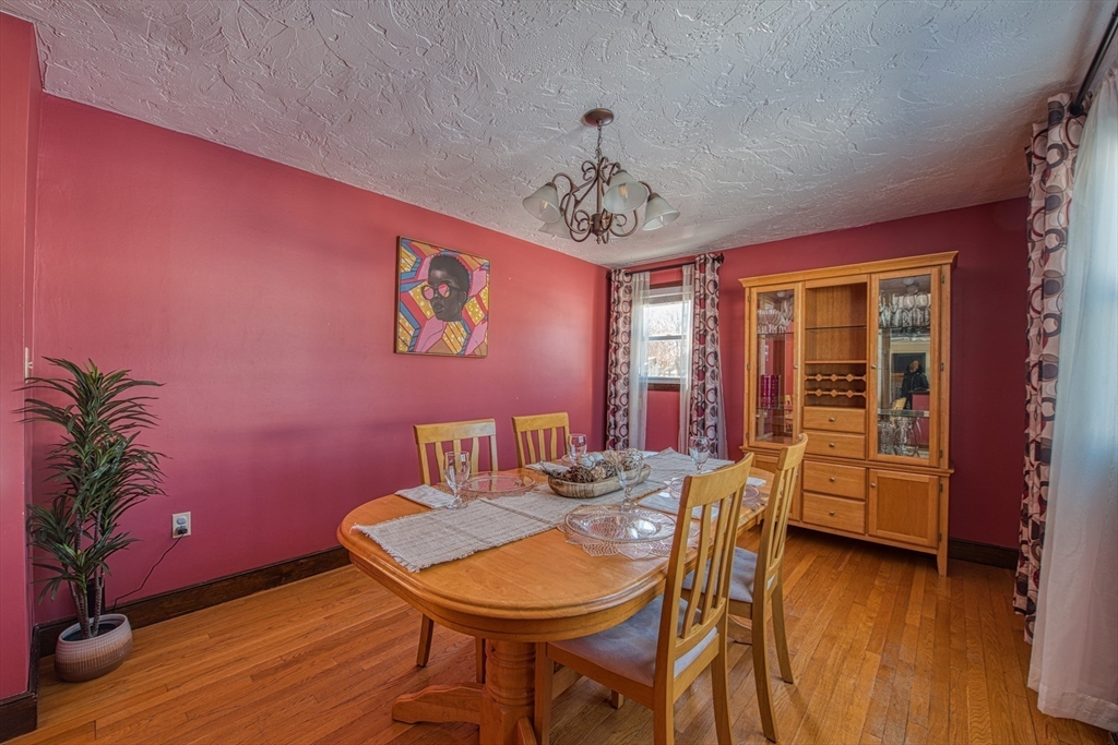 12 Brewster Road Randolph, MA 02368 - Photo 6 of 27 a view of a dining room with furniture window and wooden floor