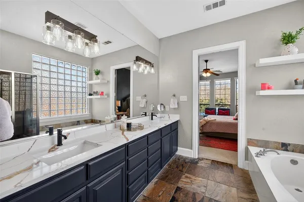 a kitchen with a stove and a chair