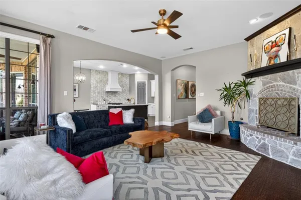 a living room with furniture and a fireplace