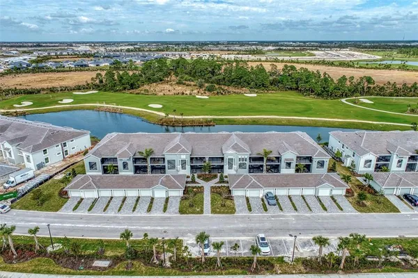 an aerial view of a house with a ocean view