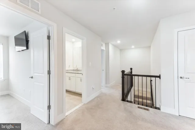 a view of a hallway with closet area