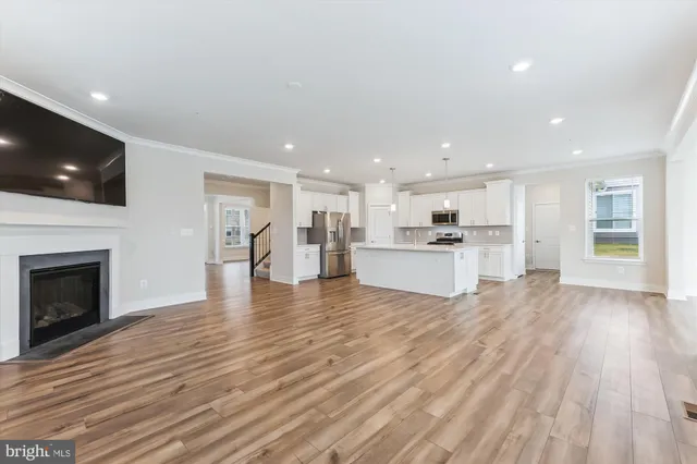 a view of kitchen and wooden floor
