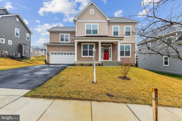 a view of a white house with swimming pool in front of it
