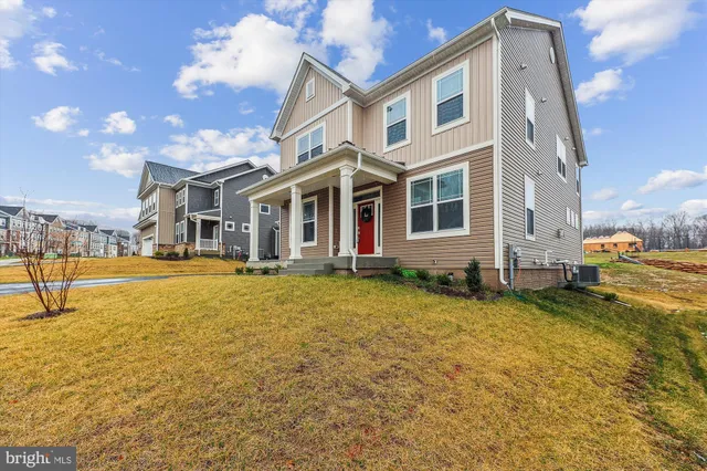 a swimming pool with outdoor seating and yard