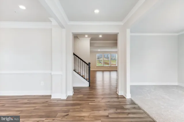 a view of an entryway with wooden floor