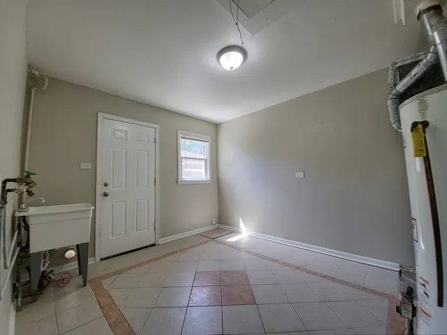 a room with a table and chairs