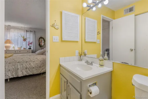 a en suite bathroom with a sink and a mirror