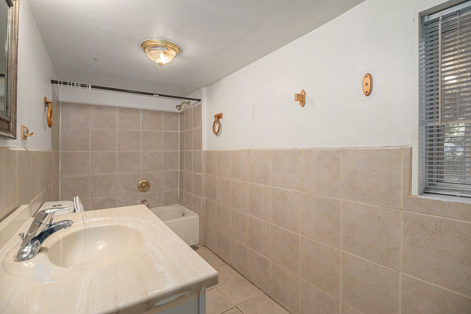 2036 Thornton Lansing Road Lansing, IL 60438 - Photo 12 of 17 a bathroom with a sink a toilet and shower