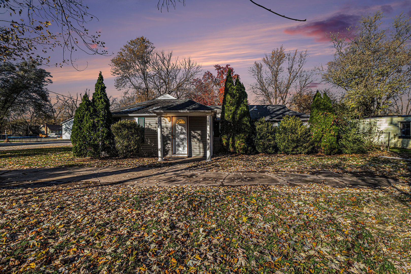 2036 Thornton Lansing Road Lansing, IL 60438 - Photo 2 of 17 a front view of a house with a yard