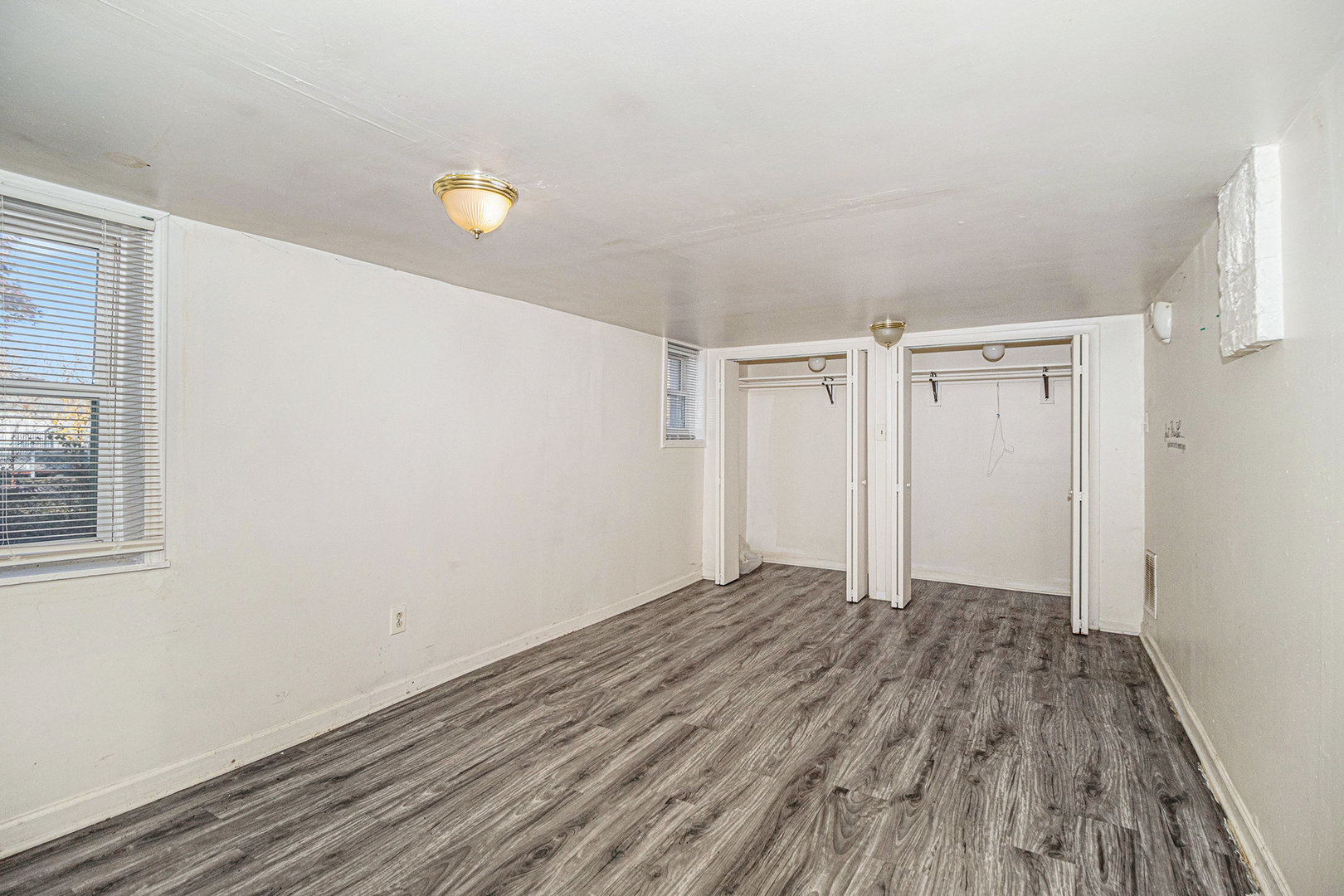 2036 Thornton Lansing Road Lansing, IL 60438 - Photo 9 of 17 a view of empty room with wooden floor and fan