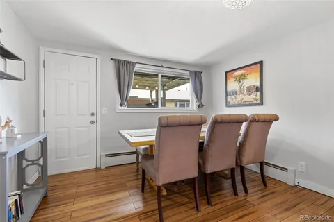 a dining room with furniture and window