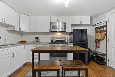 a close view of a utility room with washer and dryer
