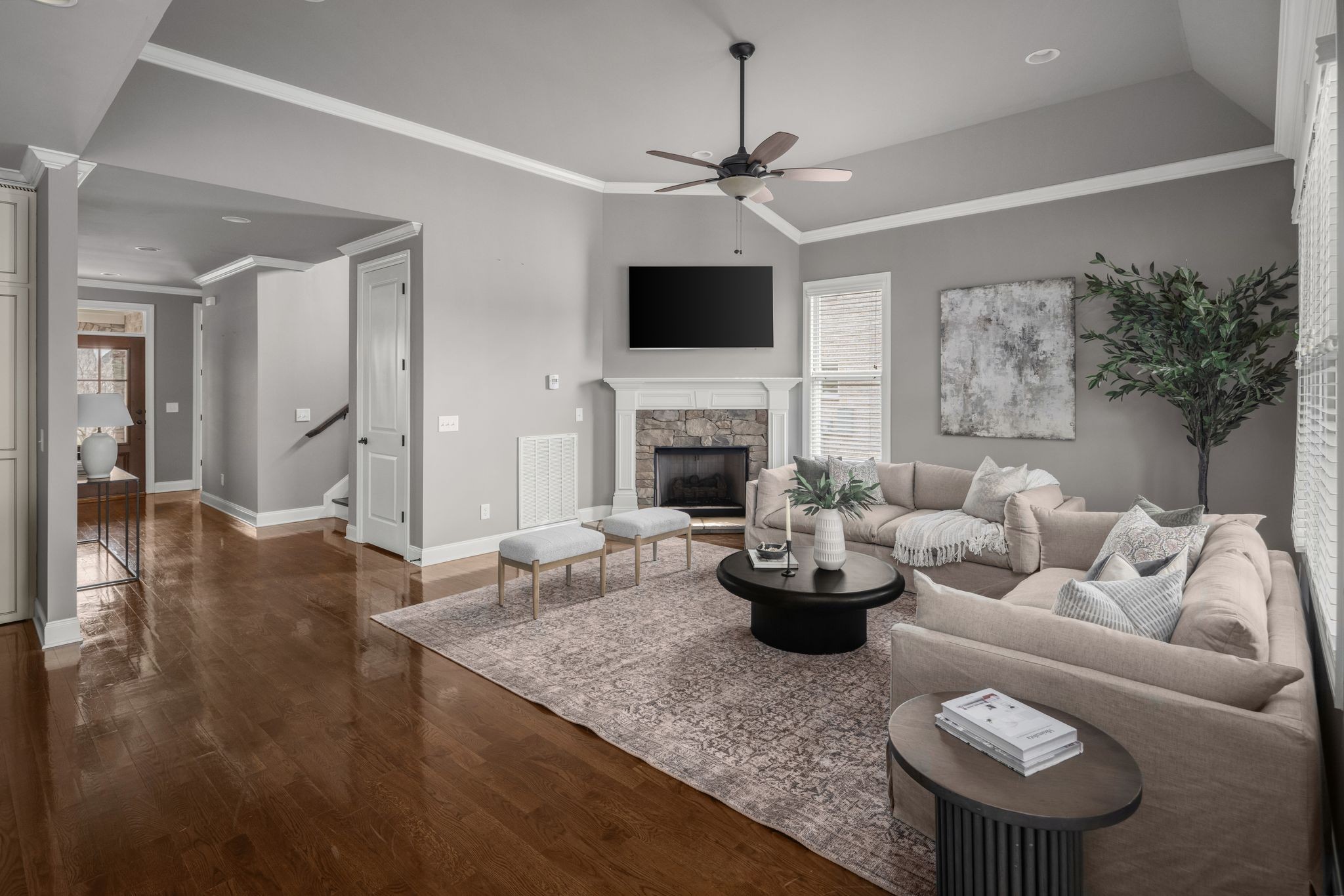 3226 Pleasantville Bridge Road Thompson's Station, TN 37179 - Photo 13 of 59 a living room with furniture a flat screen tv and a fireplace