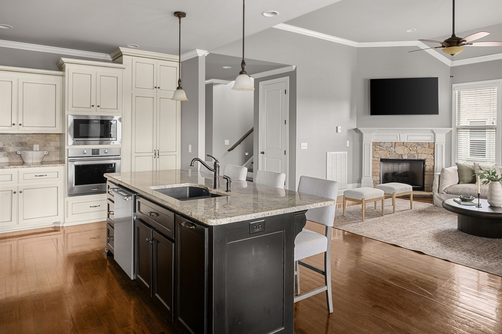 3226 Pleasantville Bridge Road Thompson's Station, TN 37179 - Photo 14 of 59 a kitchen with stainless steel appliances granite countertop a stove a sink and a fireplace