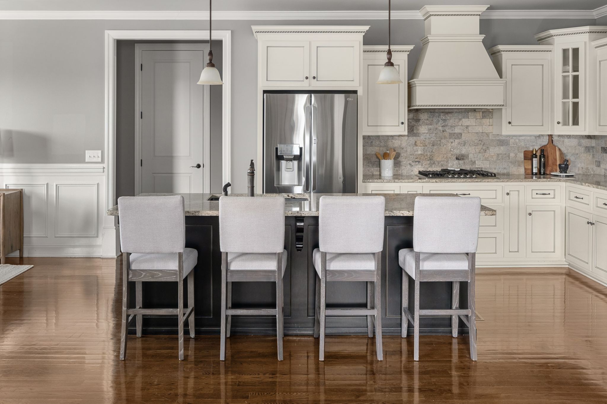 3226 Pleasantville Bridge Road Thompson's Station, TN 37179 - Photo 16 of 59 a kitchen with stainless steel appliances a dining table chairs and granite counter tops