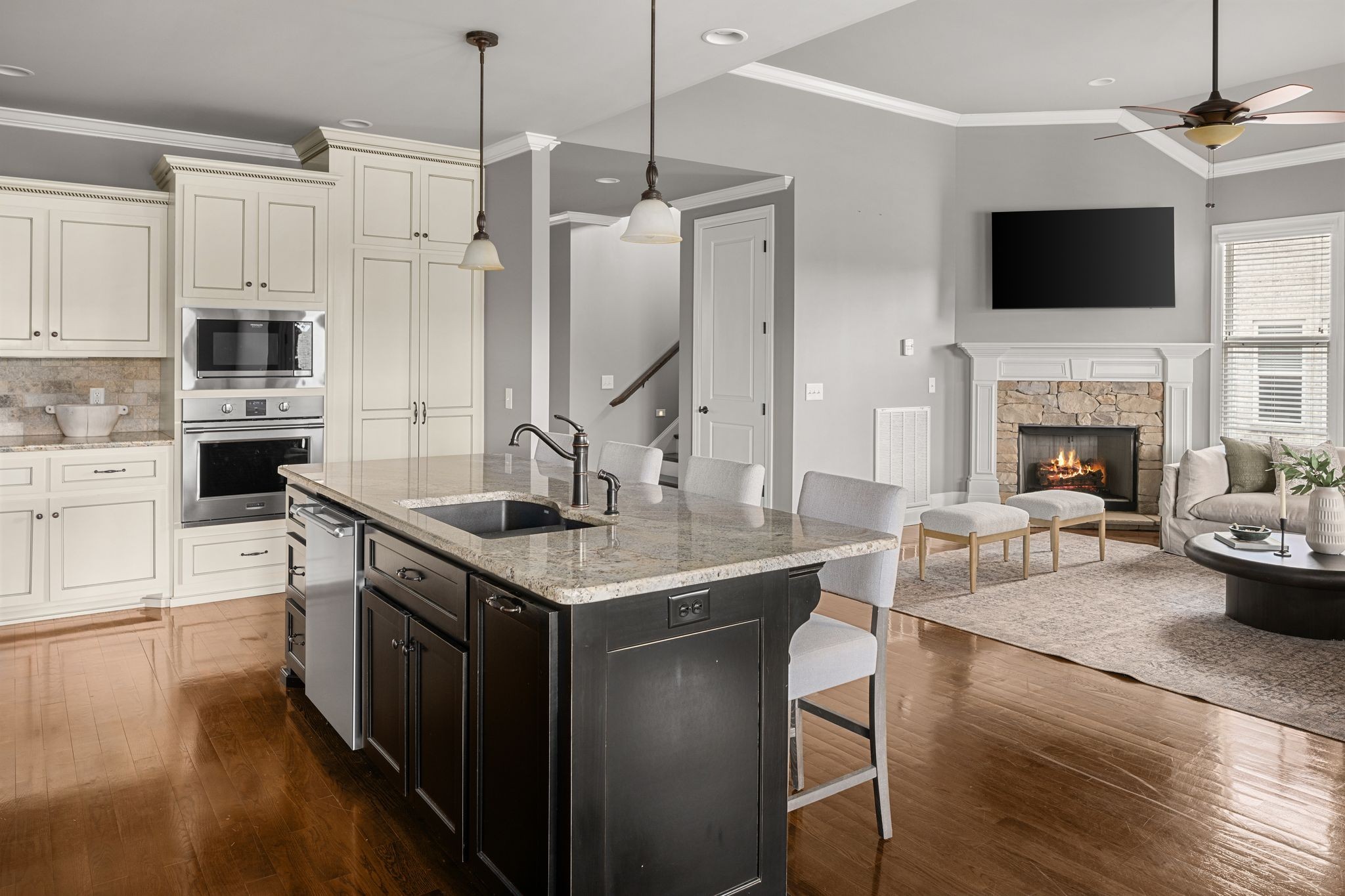 3226 Pleasantville Bridge Road Thompson's Station, TN 37179 - Photo 20 of 59 a kitchen with stainless steel appliances granite countertop a stove a sink and a fireplace