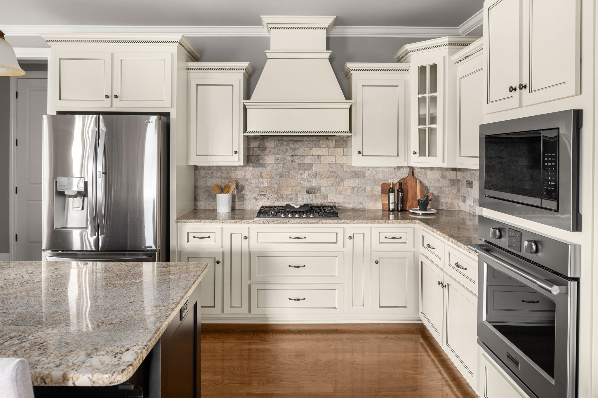 3226 Pleasantville Bridge Road Thompson's Station, TN 37179 - Photo 22 of 59 a kitchen with granite countertop white cabinets and stainless steel appliances