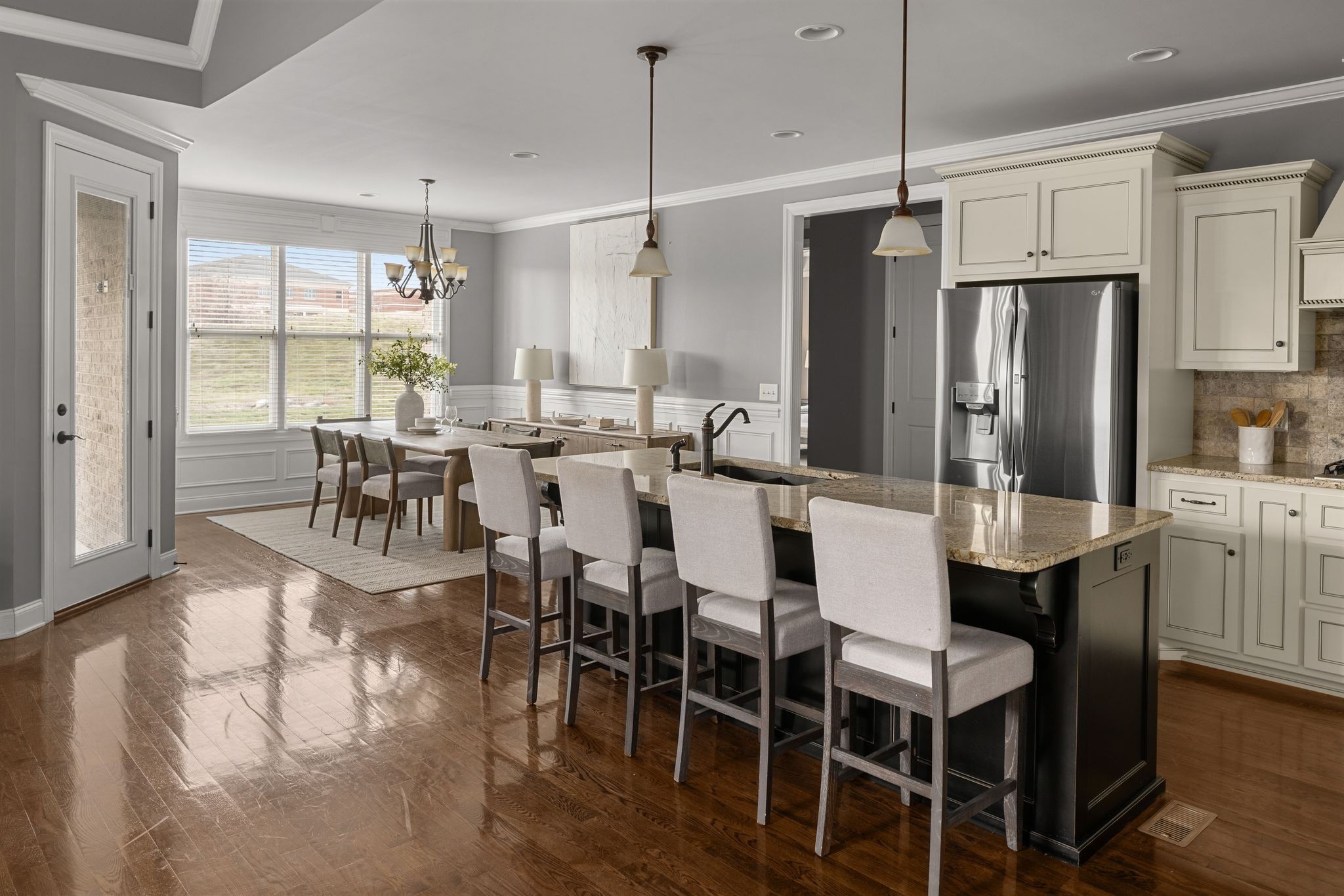 3226 Pleasantville Bridge Road Thompson's Station, TN 37179 - Photo 24 of 59 a large kitchen with a table chairs refrigerator and cabinets