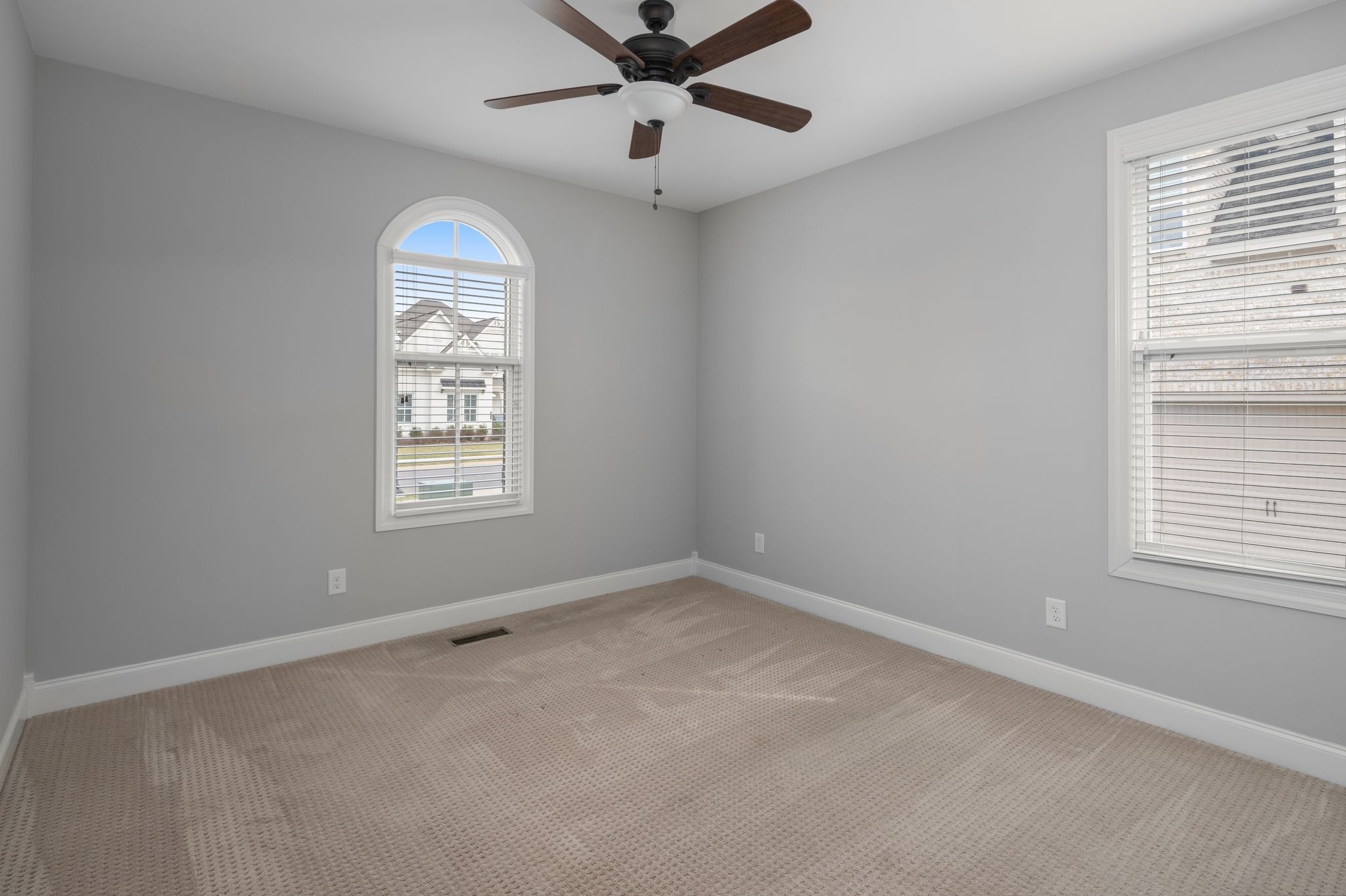 3226 Pleasantville Bridge Road Thompson's Station, TN 37179 - Photo 39 of 59 an empty room with windows and ceiling fan