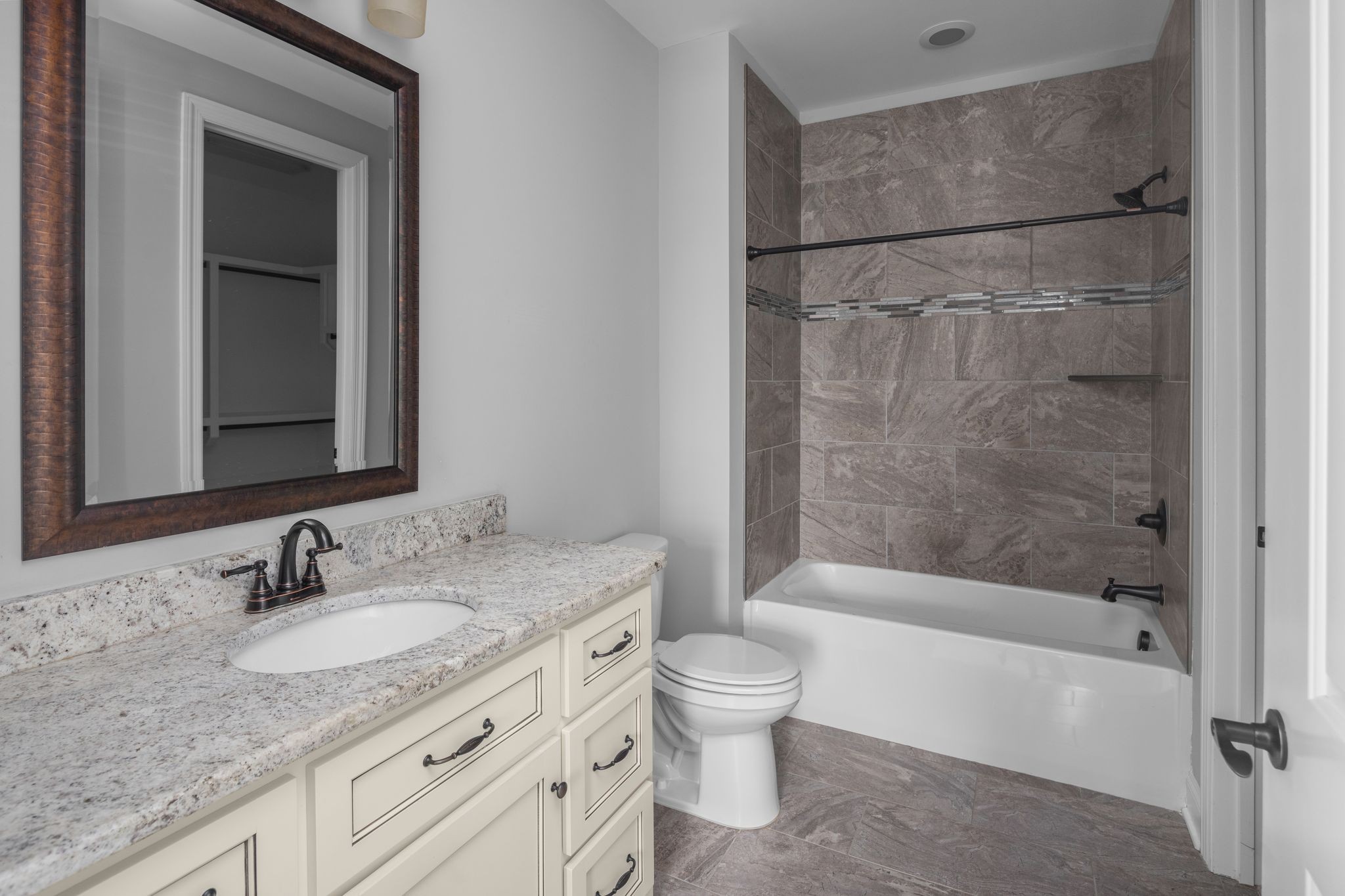 3226 Pleasantville Bridge Road Thompson's Station, TN 37179 - Photo 40 of 59 a bathroom with a granite countertop sink toilet and shower