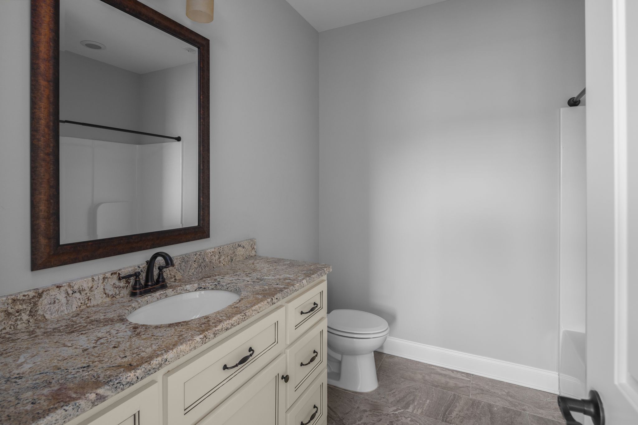 3226 Pleasantville Bridge Road Thompson's Station, TN 37179 - Photo 43 of 59 a bathroom with a granite countertop sink and a mirror