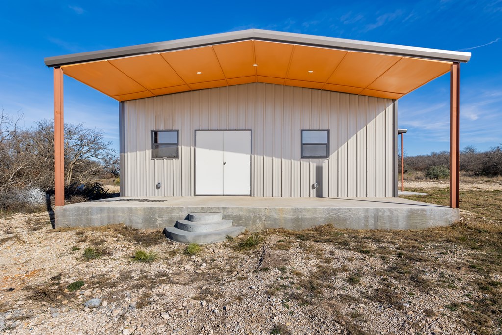 497 County Road Melvin, TX 76858 - Photo 15 of 44 a view of a house with a yard