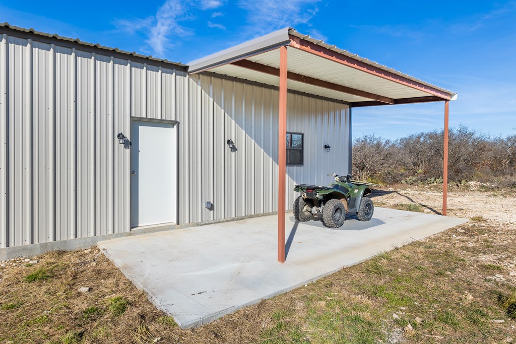 497 County Road Melvin, TX 76858 - Photo 17 of 44 a view of a backyard of a house