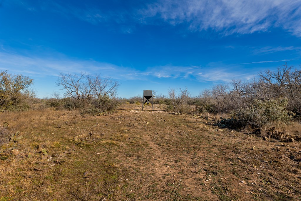 497 County Road Melvin, TX 76858 - Photo 23 of 44 a view of a lake with a mountain in the background