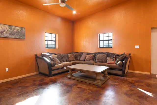 a living room with a couch and a window