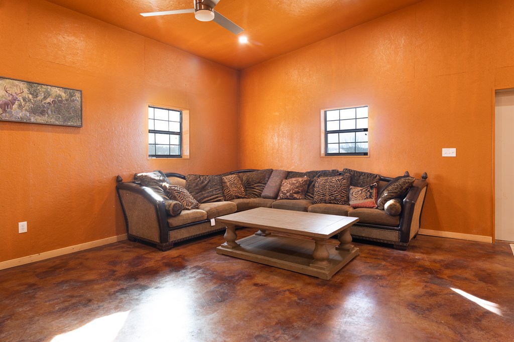 497 County Road Melvin, TX 76858 - Photo 3 of 44 a living room with a couch and a window