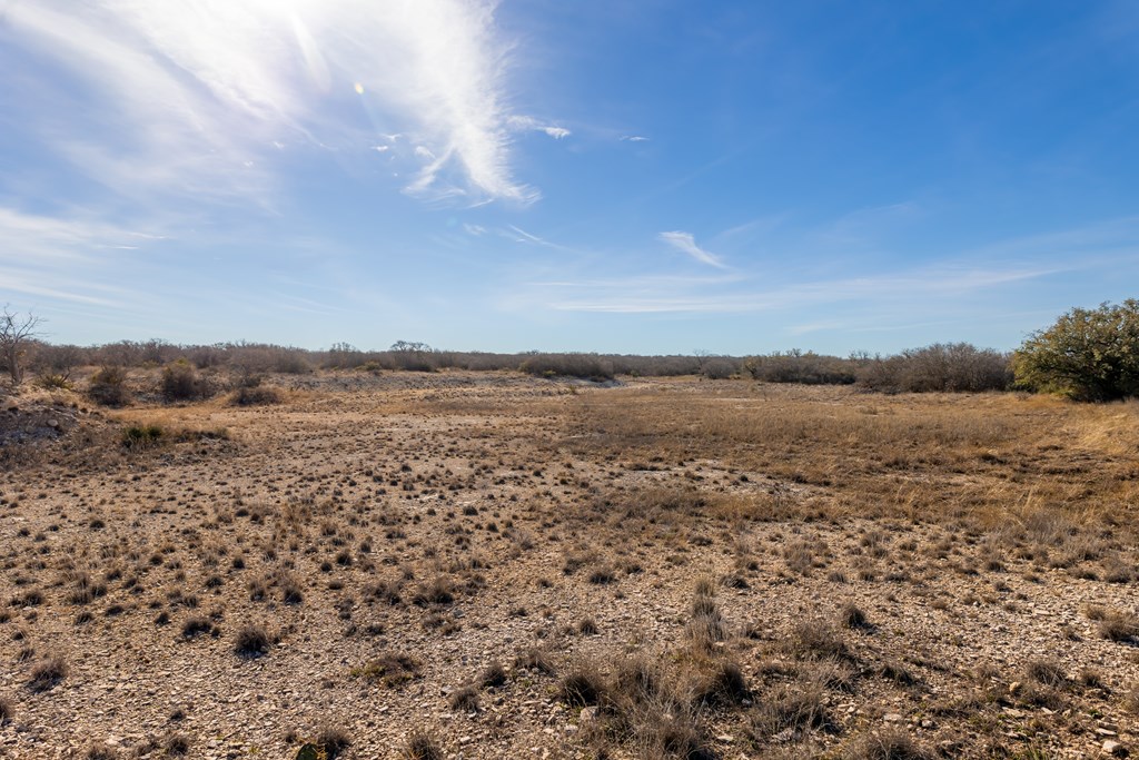 497 County Road Melvin, TX 76858 - Photo 37 of 44 a view of lake with mountain in the background