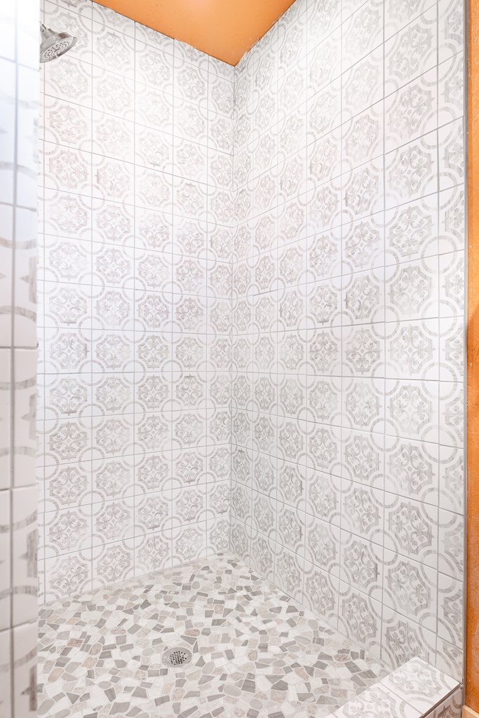 497 County Road Melvin, TX 76858 - Photo 7 of 44 a bathroom with a shower