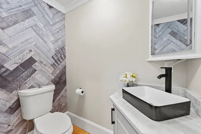 a bathroom with a toilet and a sink