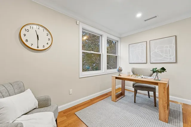 a workspace with furniture and window